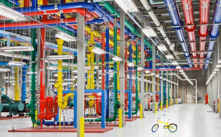 These colorful pipes send and receive water for cooling our facility. Also pictured is a G-Bike, the vehicle of choice for team members to get around outside our data centers..jpg